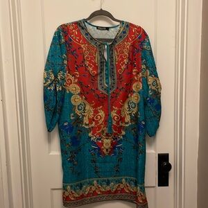 Urban Coco polyester shift dress with tie neckline and gathered sleeves.